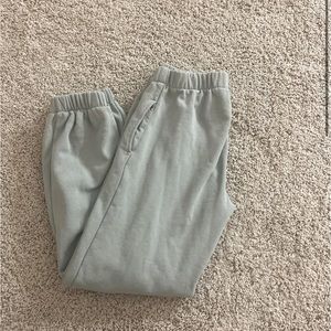 Pale sage color brandy Melville John half sweatpants NWOT